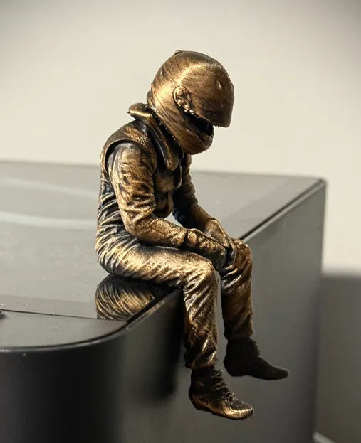 Sad F1 Driver Sitting on a ledge Figurine!