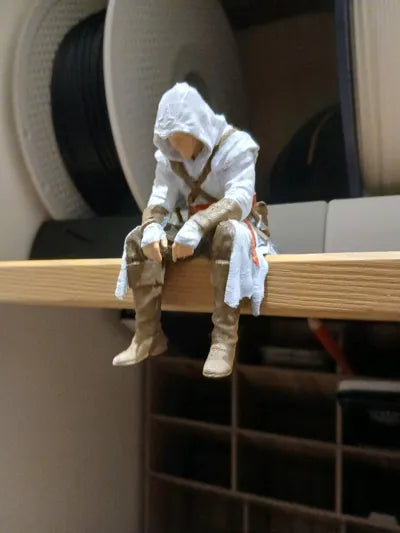 Sad Assassin's Creed sitting on a ledge Figurine
