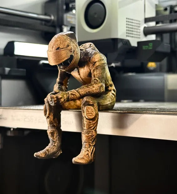 Sad MotoGP Rider on a ledge Figurine!