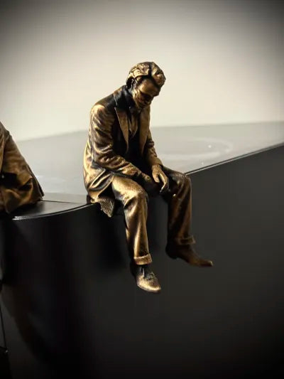Sad Joker Figurine sitting on a ledge!
