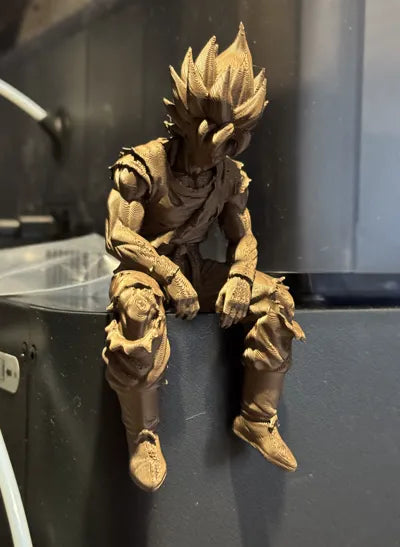 Sad Goku Figurine Sitting on a ledge!
