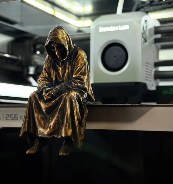 Sad Grim Reaper sitting on a ledge Figurine!