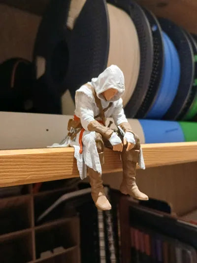 Sad Assassin's Creed sitting on a ledge Figurine