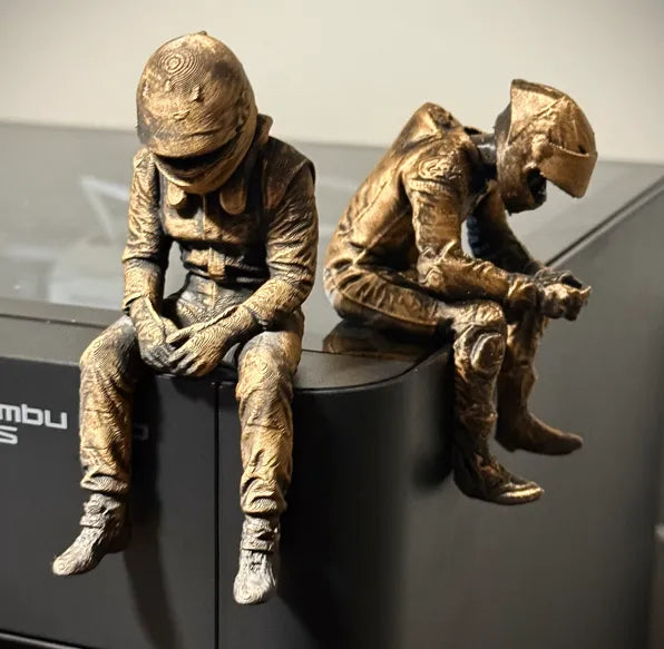 Sad F1 Driver Sitting on a ledge Figurine!