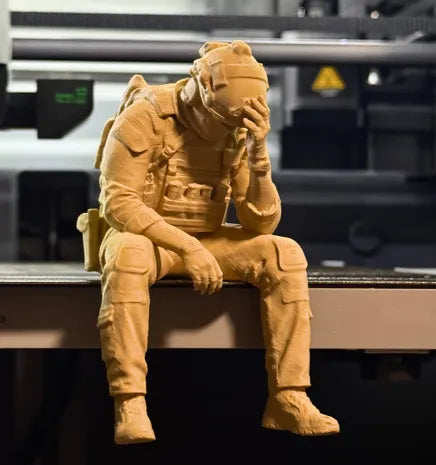 Sad Soldier sitting on a ledge Figurine!
