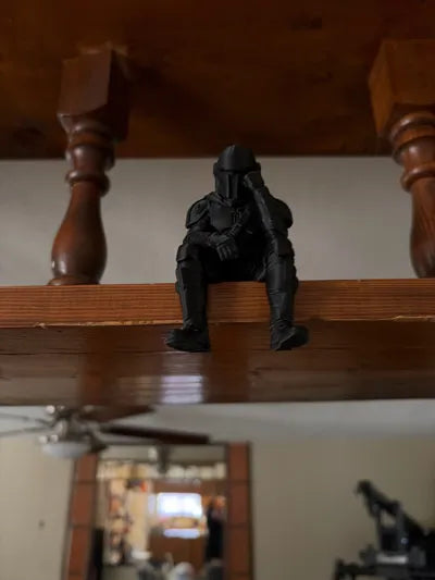 Sad Mandalorian on a ledge Figurine!