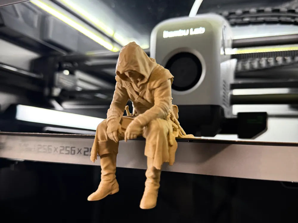 Sad Assassin's Creed sitting on a ledge Figurine