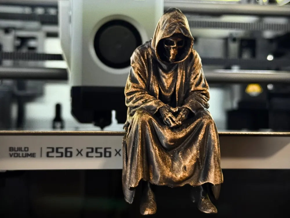 Sad Grim Reaper sitting on a ledge Figurine!