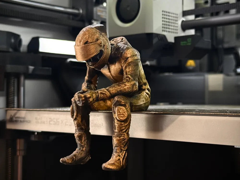 Sad MotoGP Rider on a ledge Figurine!