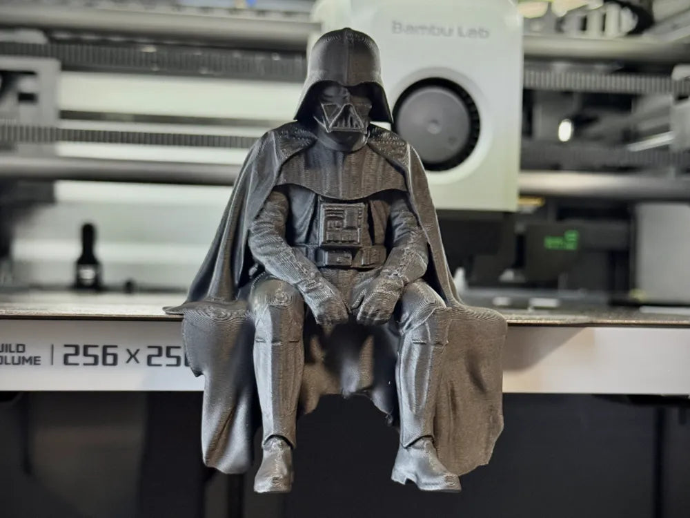 Sad Darth Vader sitting on a ledge figurine!