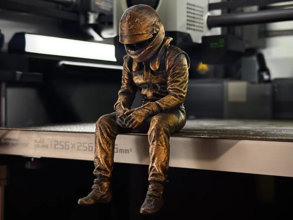 Sad F1 Driver Sitting on a ledge Figurine!