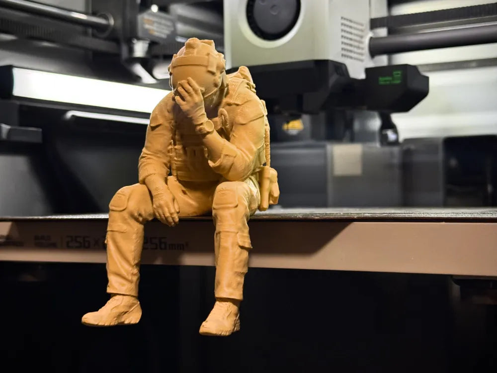 Sad Soldier sitting on a ledge Figurine!