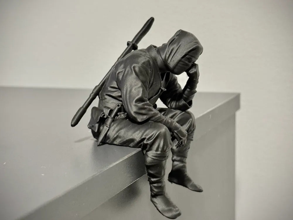 Sad Ninja sitting on a ledge Figurine!