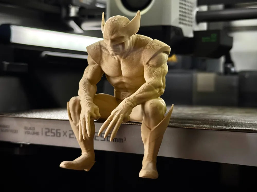 Sad Wolverine sitting on a ledge figurine!