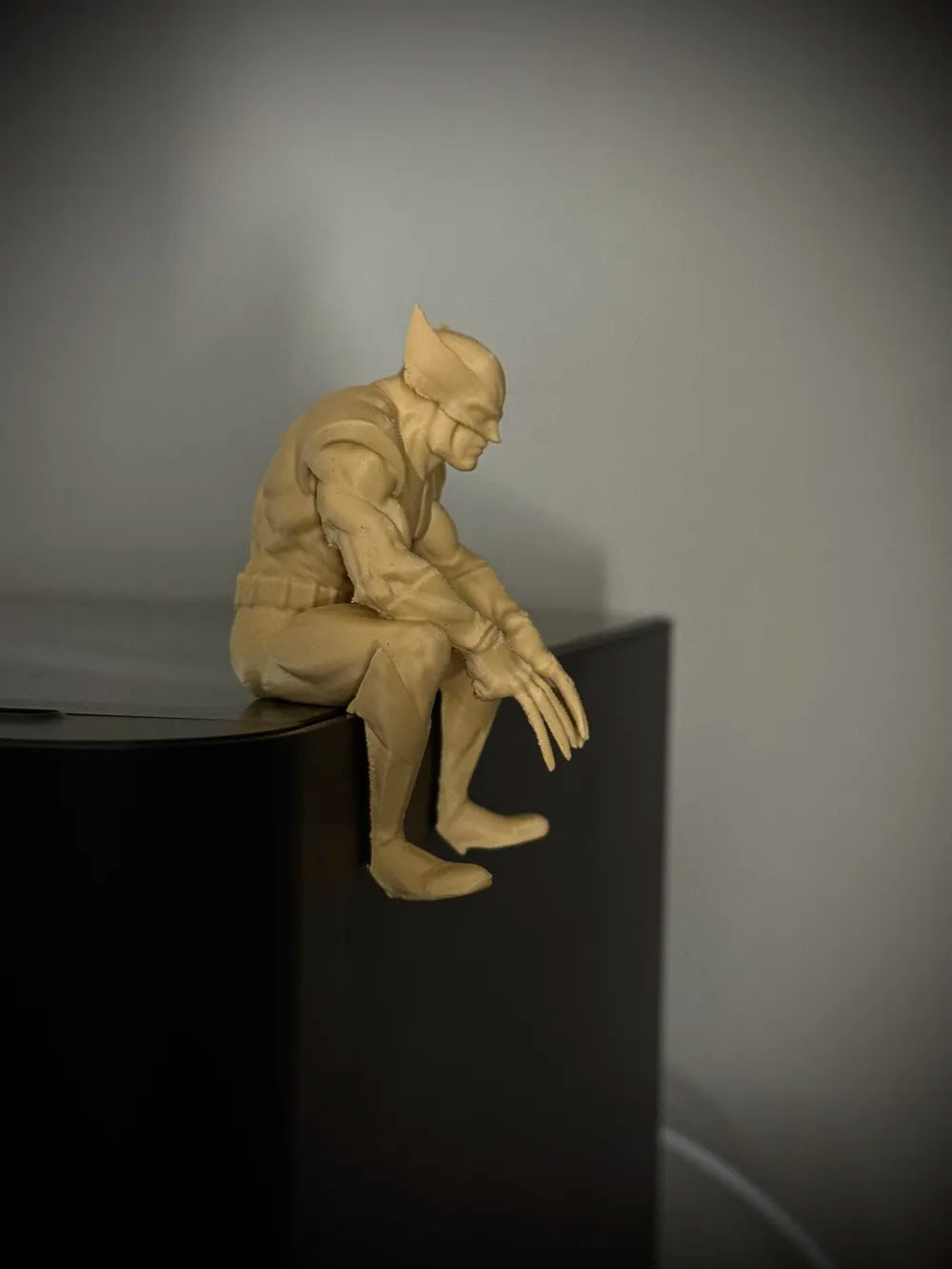 Sad Wolverine sitting on a ledge figurine!