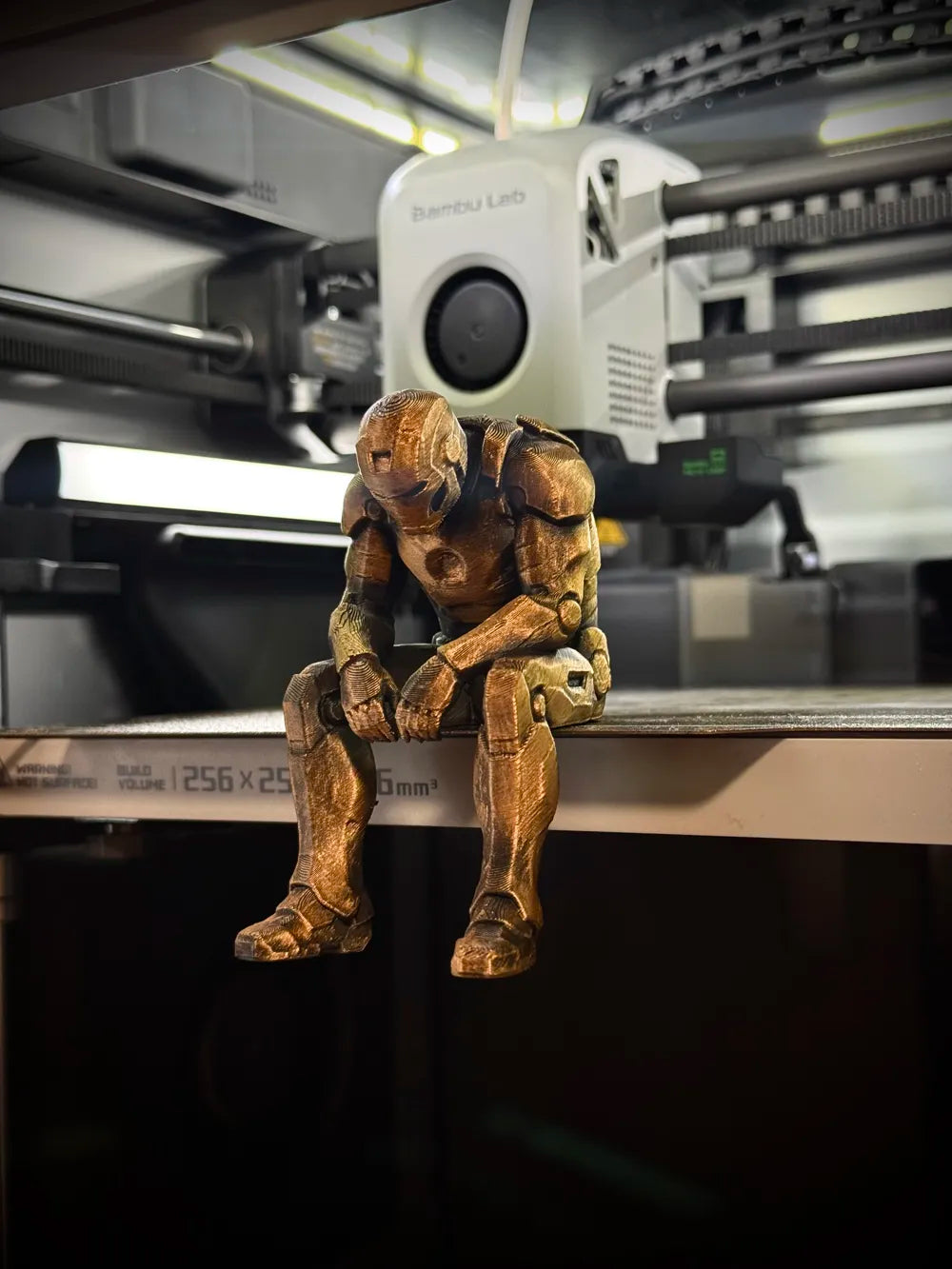 Sad Iron Man Figurine sitting on a ledge!