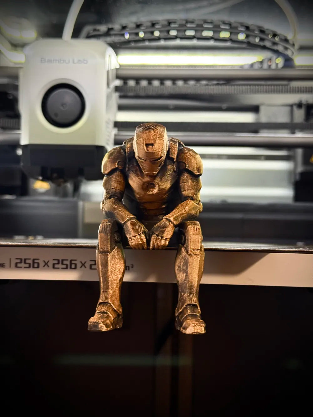 Sad Iron Man Figurine sitting on a ledge!