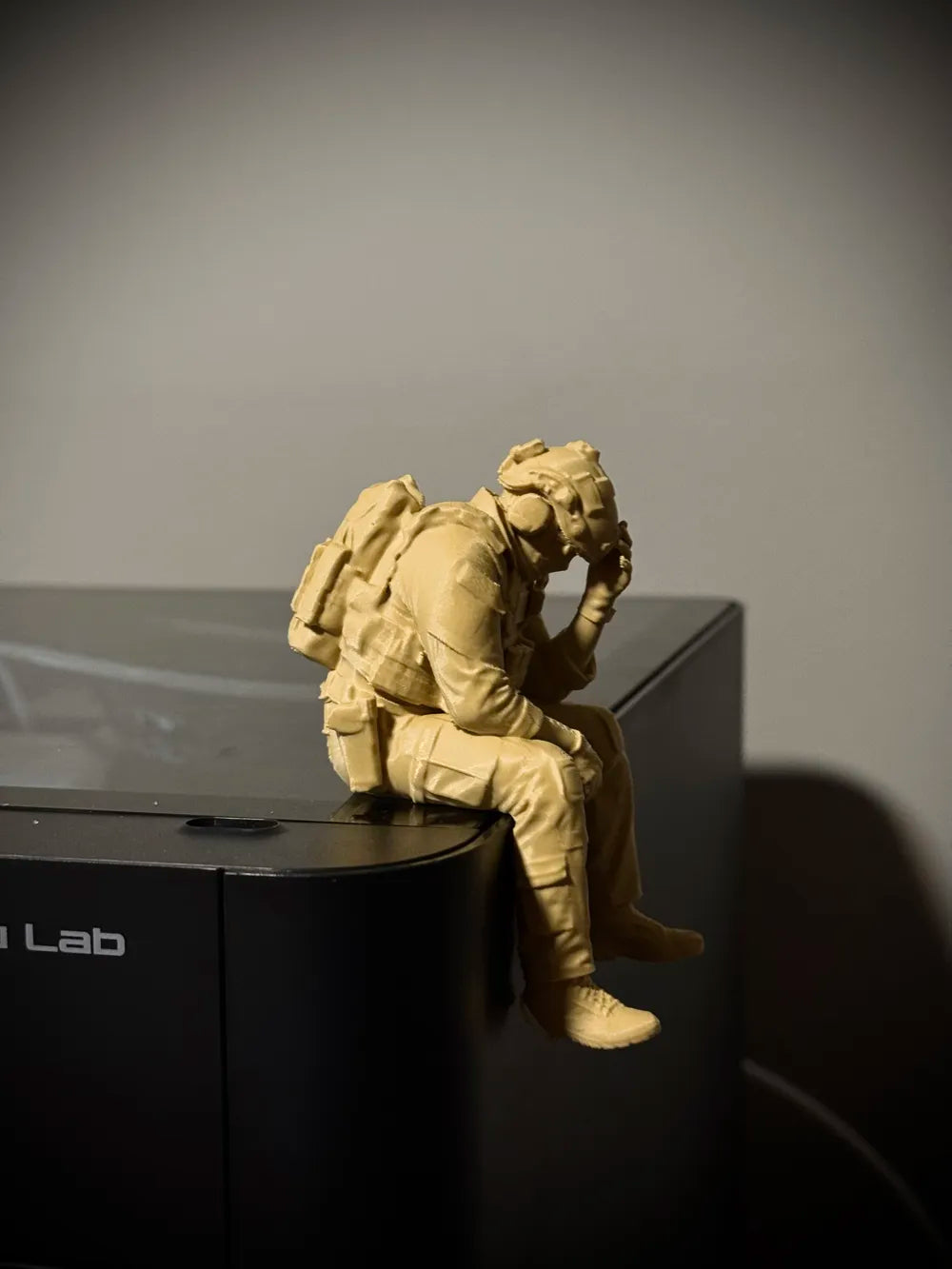 Sad Soldier sitting on a ledge Figurine!