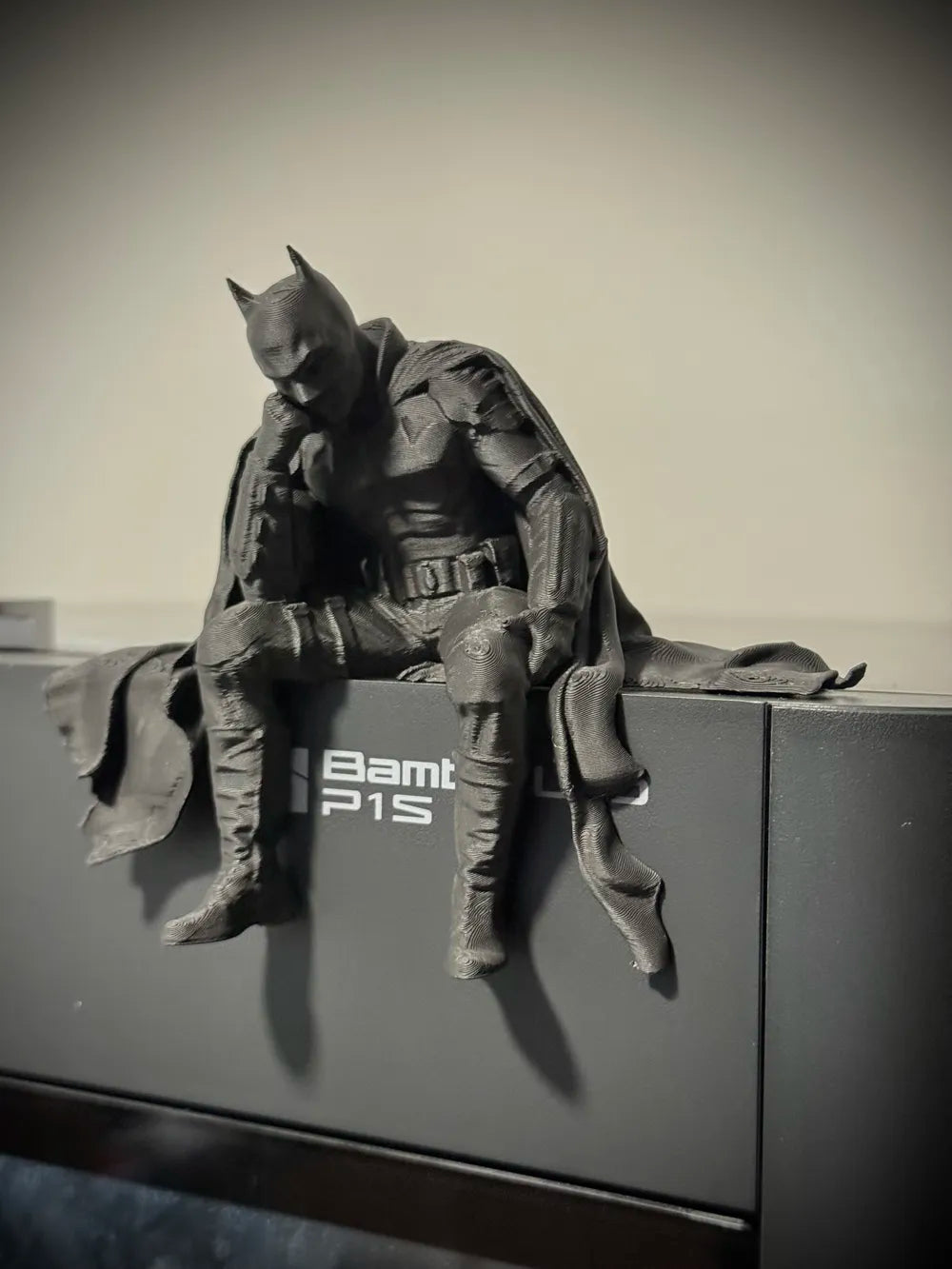 Sad Batman sitting on a Ledge Figurine!