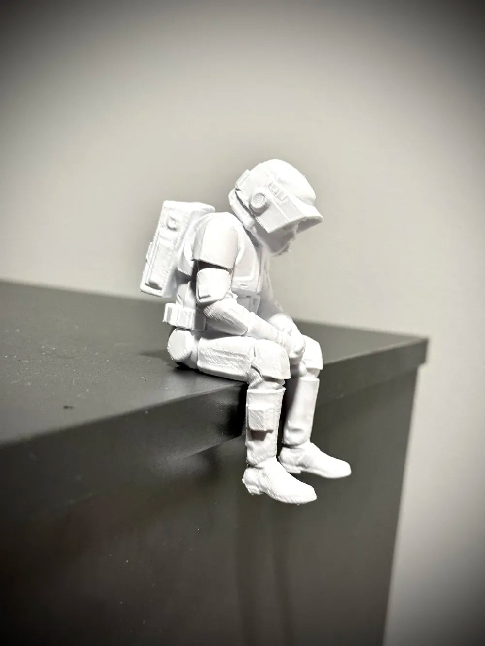Sad Scout Trooper sitting on a ledge Figurine!