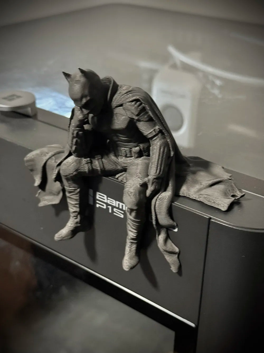 Sad Batman sitting on a Ledge Figurine!