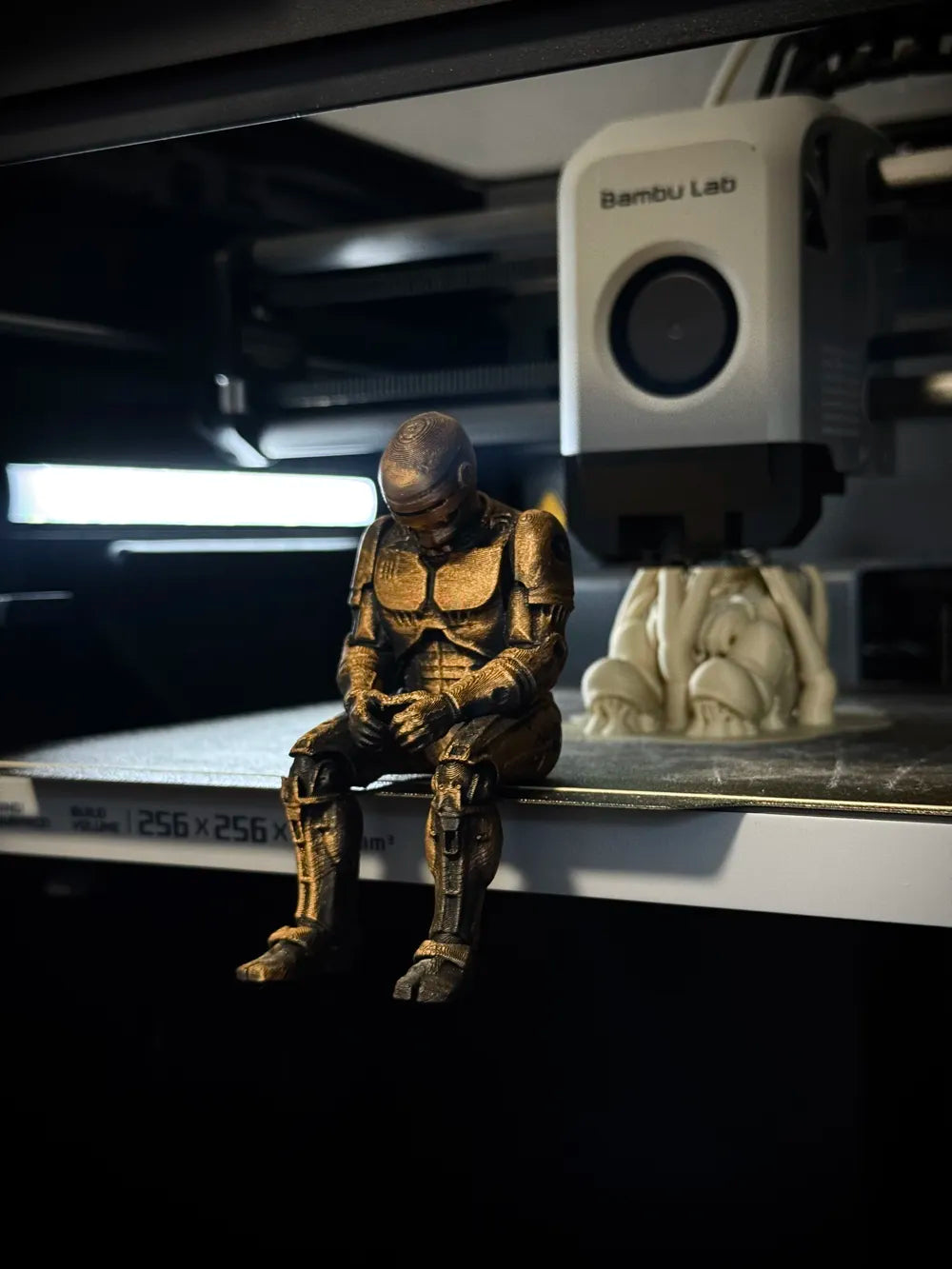 Sad RoboCop figurine sitting on a ledge!
