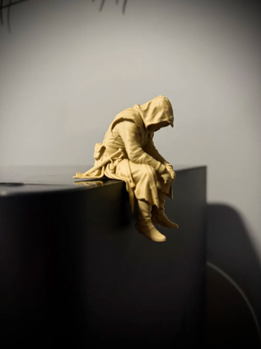 Sad Assassin's Creed sitting on a ledge Figurine