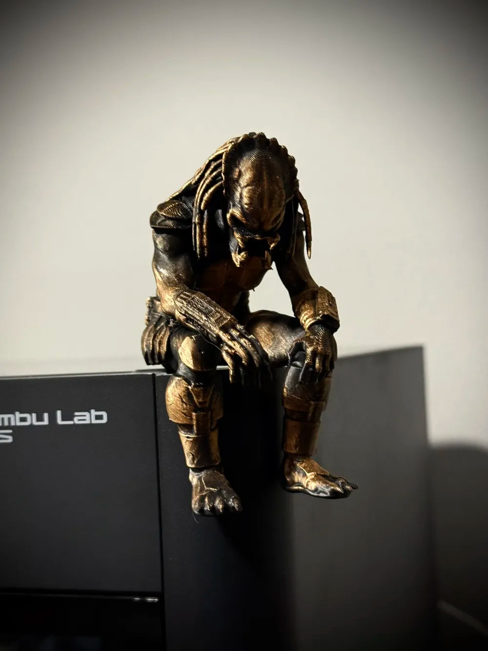 Sad Predator Figurine sitting on a ledge!
