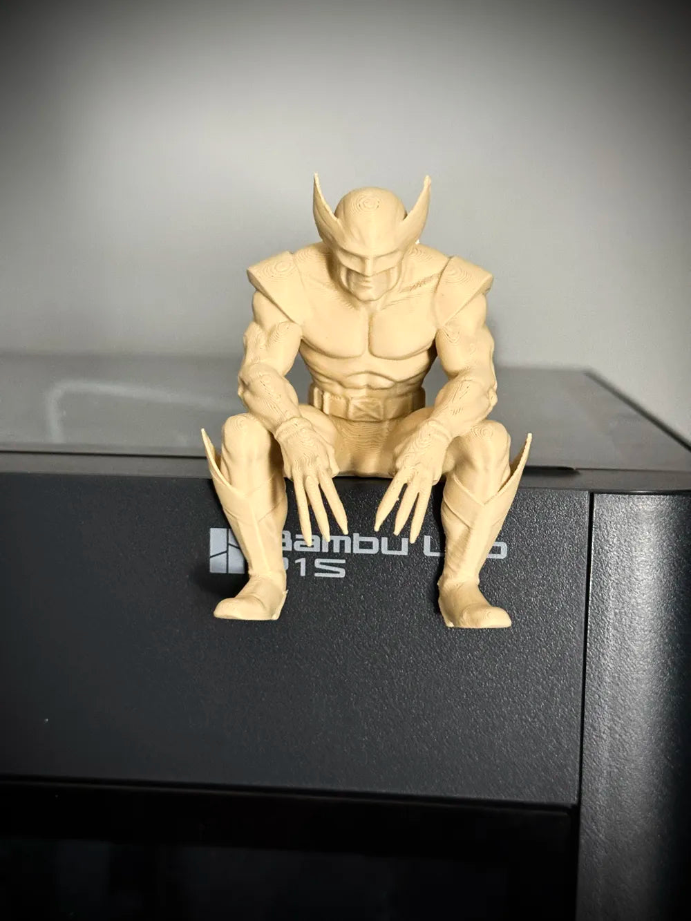 Sad Wolverine sitting on a ledge figurine!