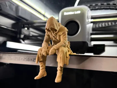 Sad Assassin's Creed sitting on a ledge Figurine
