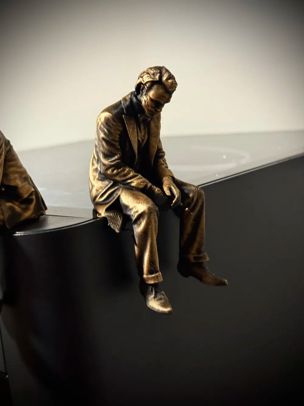 Sad Joker Figurine sitting on a ledge!