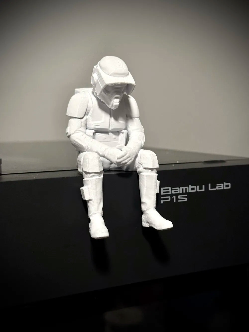 Sad Scout Trooper sitting on a ledge Figurine!