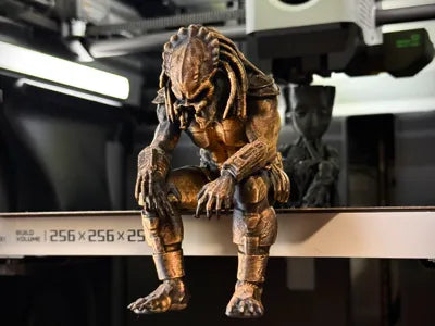 Sad Predator Figurine sitting on a ledge!