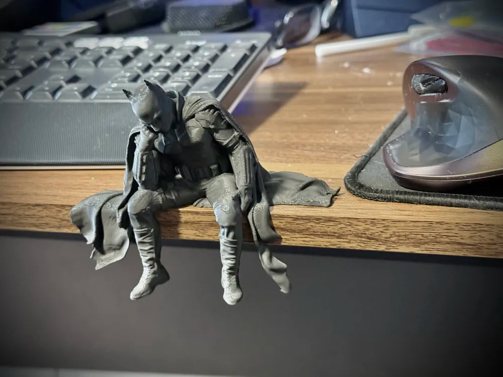 Sad Batman sitting on a Ledge Figurine!