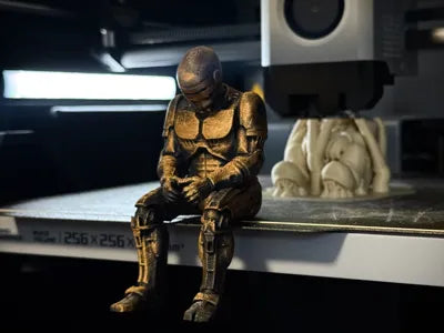 Sad RoboCop figurine sitting on a ledge!