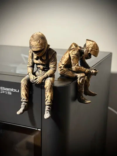 Sad F1 Driver Sitting on a ledge Figurine!