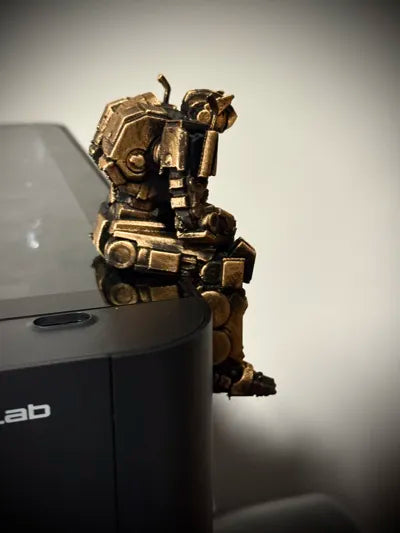 Sad Optimus Prime sitting on a ledge figurine!