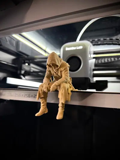 Sad Assassin's Creed sitting on a ledge Figurine