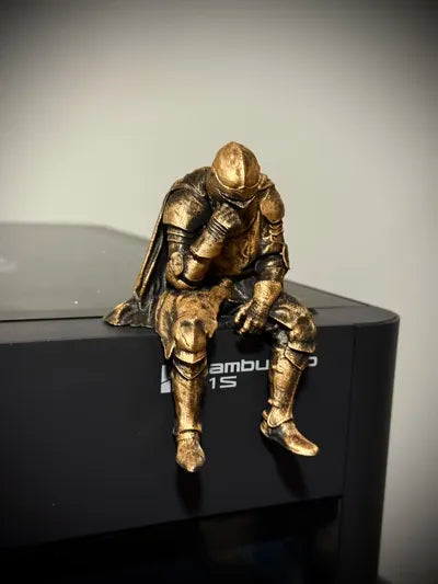 Sad Knight sitting on a ledge Figurine!