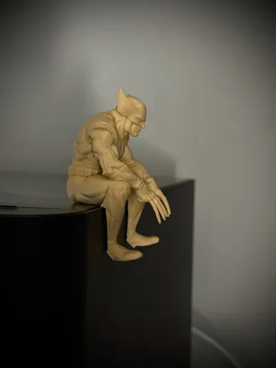 Sad Wolverine sitting on a ledge figurine!