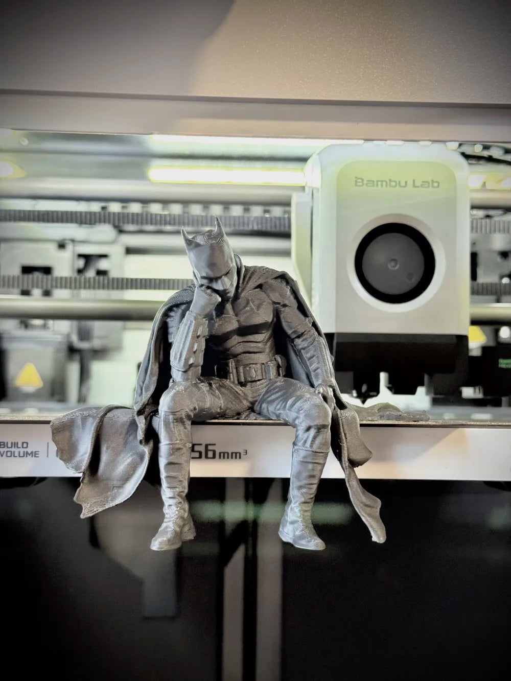 Sad Batman sitting on a Ledge Figurine!