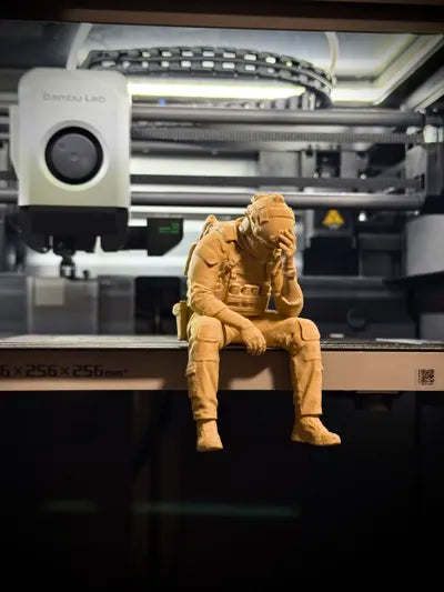 Sad Soldier sitting on a ledge Figurine!