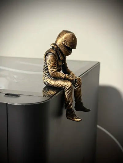 Sad F1 Driver Sitting on a ledge Figurine!
