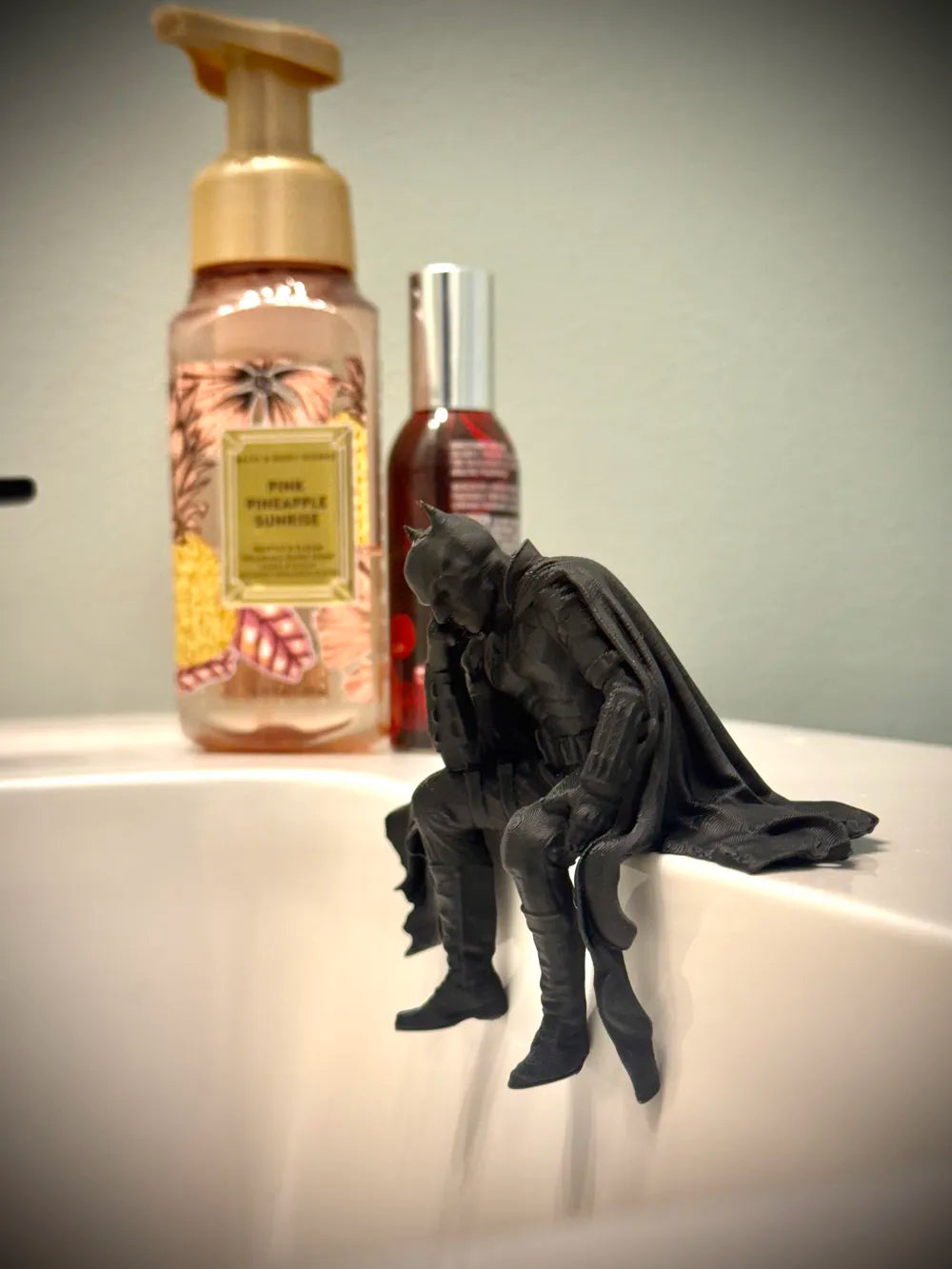 Sad Batman sitting on a Ledge Figurine!