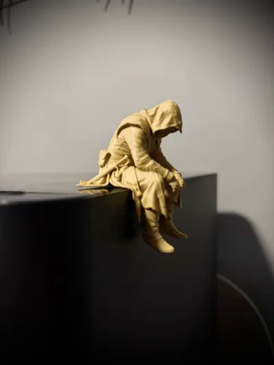 Sad Assassin's Creed sitting on a ledge Figurine