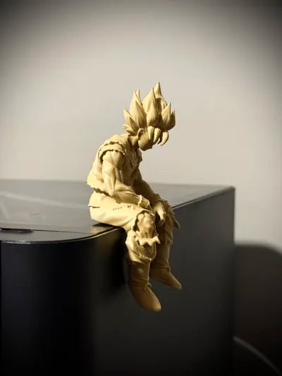 Sad Goku Figurine Sitting on a ledge!