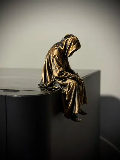 Sad Grim Reaper sitting on a ledge Figurine!