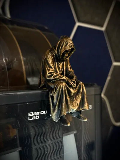 Sad Grim Reaper sitting on a ledge Figurine!
