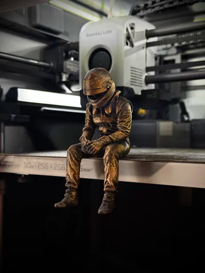 Sad F1 Driver Sitting on a ledge Figurine!