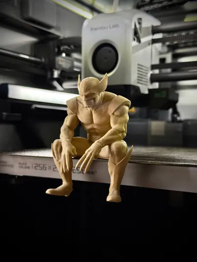Sad Wolverine sitting on a ledge figurine!
